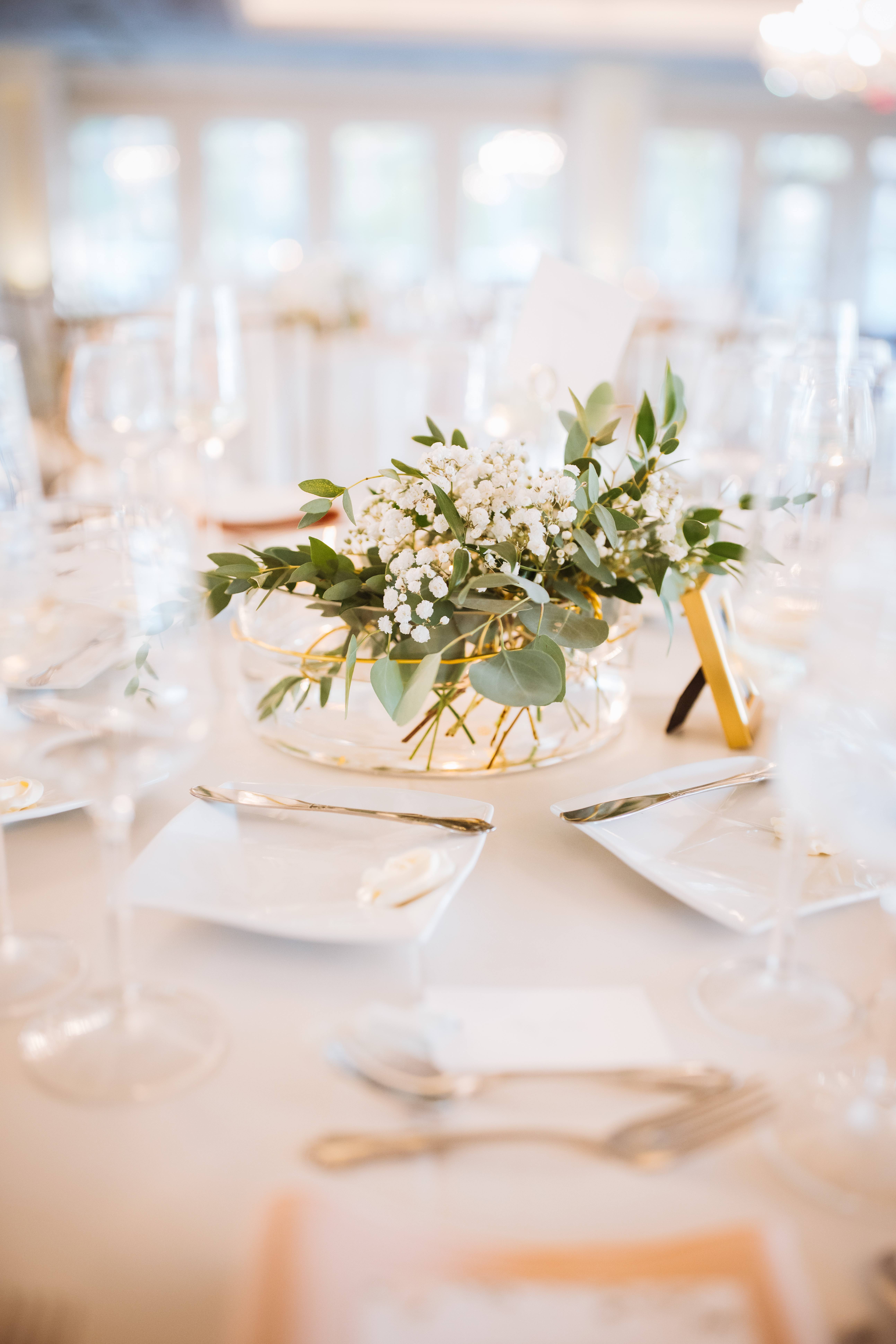 Elegant wedding table centerpiece with baby's breath and eucalyptus.